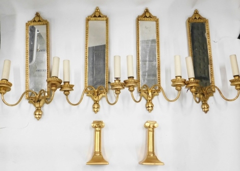 Various girandole giltwood mirrors, with candle sconces, surmounted with canvas leaf borders, 44cm high, and a similarly decorated pair of candle sticks