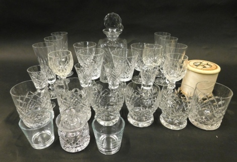 Various crystal glassware, a decanter, drinking glasses, champagne flutes and an enlarged Sylko cotton reel, 10cm high. (a quantity)