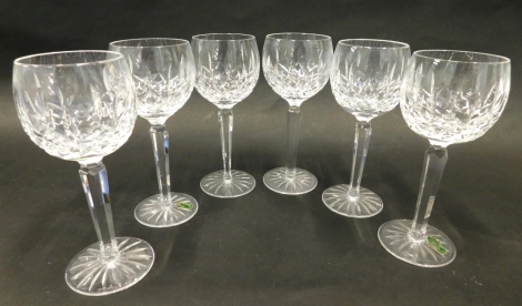 A set of six Waterford Crystal hock glasses, each hobnail cut with a floral pattern, on turned stems and circular star cut feet, marked beneath, 20cm high.