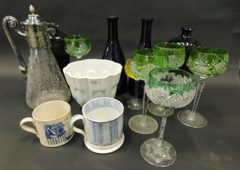 Various pottery and glassware, five green glass hock glasses, 21cm high, an etched claret jug with silver plated mounts, Bristol blue style decanter bottles, 19thC pearlware cups, to include The Frog's Wooing, jelly mould, etc. (a quantity)