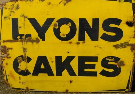 A 20thC Lyons Cakes enamel sign, in black lettering on yellow ground, 74cm x 96cm