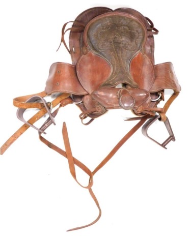 A leather saddle no. 512, with some tool work and floral roundels to the back, 46cm long.