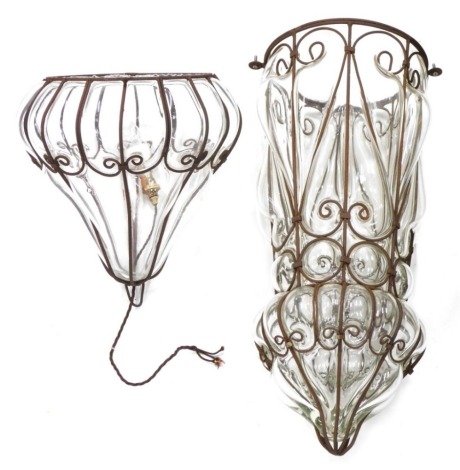 An elaborate metal framed glass shade, with shaped top and modern electrical fitting, 102cm high.