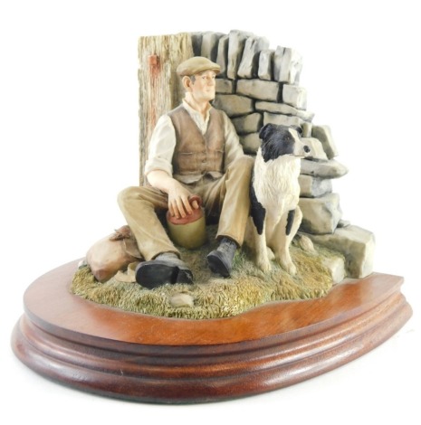 A Border Fine Arts limited edition figure group, shepherd and sheep dog aside wall, marked AH, no. 892/1500, on wooden plinth base, 20cm high.