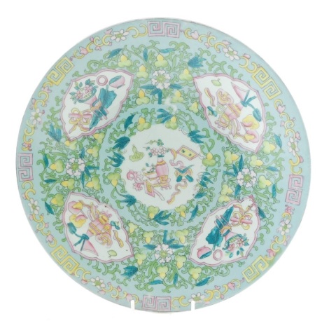 A Russian Gardner Chinese style famille vert dish, profusely decorated with panels of vases, with a floral and Greek key border, polychrome decorated, marked beneath, 34cm diameter. Ex-Fulbeck Hall Collection.