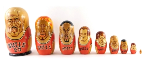 An unusual Chicago Bulls related Russian wooden doll set, with Michael Jordan outer figure, 29cm high.