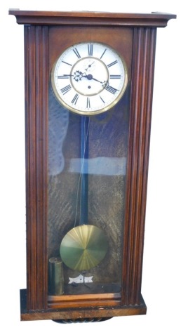 A late 19thC walnut cased Vienna wall clock, with 17cm diameter, Roman numeric dial in a three part glazed case with single weight, 83cm high.