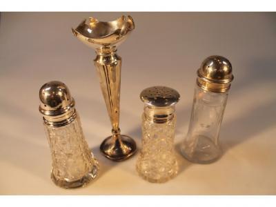 Three silver capped glass sugar castors and a silver specimen vase