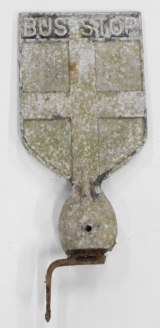 A Lincolnshire aluminium bus stop sign, of shield form and cast with a cross, signs of original red paint, 36cm high, 18.5cm wide.