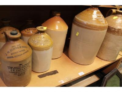 Various large earthenware storage bottles