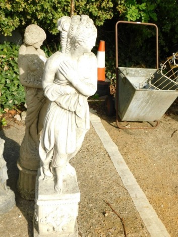 A female concrete classical garden statue, 110cm high.