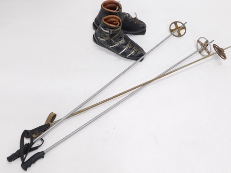 A pair of vintage ski boots and a pair of vintage Henke Swiss ski boots, size unknown, and three various walking skis, 130cm high, etc. (a quantity)