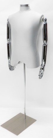 A tailor's mannequin torso, with articulated chrome arms, on rectangular plate base, 151cm high.