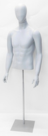 A plastic tailor's mannequin, with head and torso, on turned stem and square base, 172cm high.