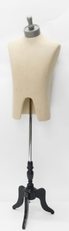 A tailor's mannequin torso, with cylindrical mount for head, on cylindrical stem and triple cabriole legs, 144cm high.