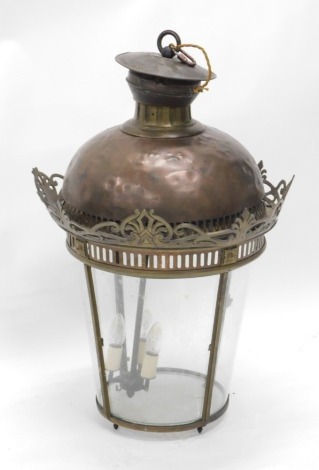 A late 19thC copper lantern, of tapering cylindrical form, with four glazed panels, the the domed top numbered 1594, the inner section numbered 148 with initials, with an upper pierced border and fist and scroll handle to the front, with partial cord fitt