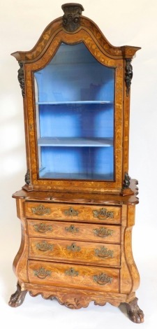 An early 19thC Dutch walnut and floral marquetry cabinet, the top with a glazed door and sides, and an arched crest enclosing a blue paper lined interior, the bombe fronted base with a moulded shaped top, above four graduated drawers each with elaborate g