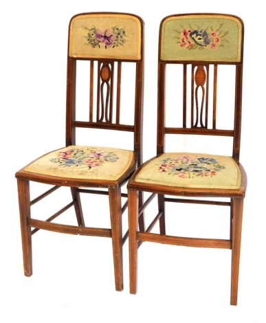 A pair of Edwardian mahogany and boxwood strung bedroom chairs, each with a woolwork padded back and seat, on square tapering legs.