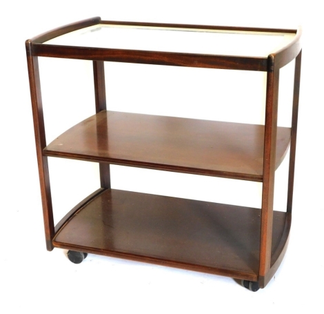 A mahogany three tier drinks trolley, the glass top with frosted borders, on plain end supports with castors, 77cm wide.