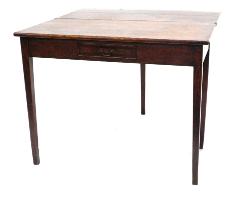 An early 19thC oak and mahogany fold over tea table, with a small frieze drawer, on square tapering legs, 92cm wide.