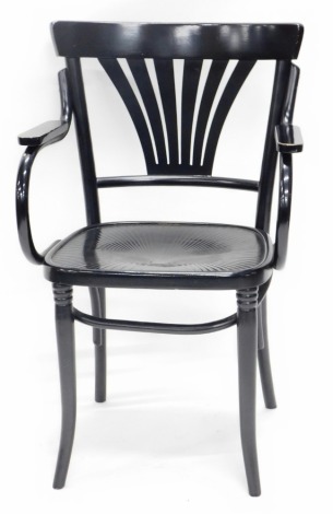 An ebonised bentwood armchair, with a pierced splat and solid seat, on tapering legs.