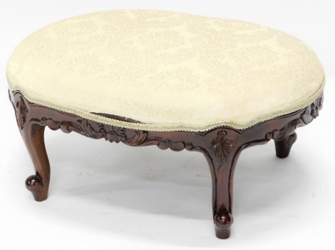 A 19thC style walnut footstool, with a padded seat, on cabriole legs, 58cm wide. The upholstery in this lot does not comply with the 1988 (Fire & Fire Furnishing) Regulations, unless sold to a known exporter or upholsterer it will be cut from the frame be