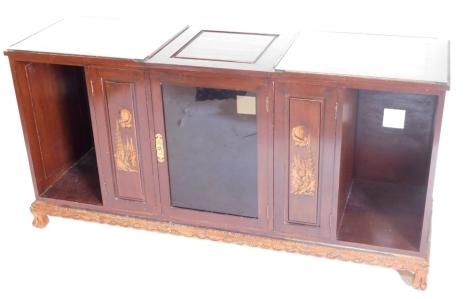 A Chinese hardwood side cabinet, with a part glazed top, the central section hinged to enclose an interior above an arrangement of two narrow carved doors, a central glazed door and two recesses, on shaped base with feet, 150cm wide.