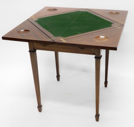 An Edwardian mahogany and tulipwood cross banded envelope card table, with a frieze drawer on square tapering legs, 55cm wide.