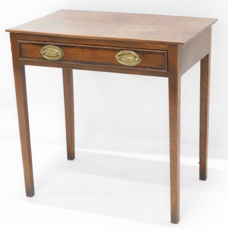 An early 19thC oak side table, of plain form with a single mahogany cross banded frieze drawer with oval brass handles on square tapering legs, 71cm wide.