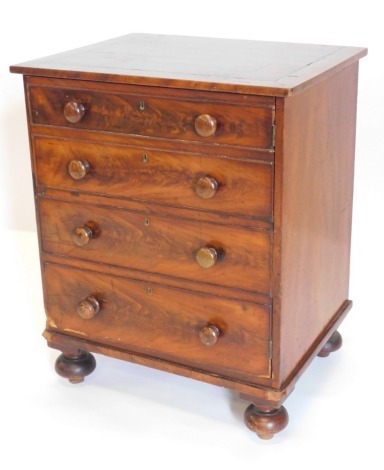 A 19thC ebony strung cupboard, with a single door formed as four false drawers, turned handles on bun feet, 77cm high, 62cm wide.