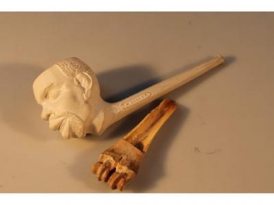 A large clay pipe moulded as a African native