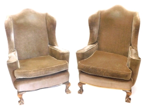 A pair of mahogany wingback chairs, upholstered in brown fabric on cabriole legs.