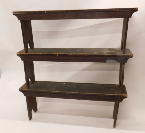 A set of three late 19th/early 20thC stained pine benches, each on shaped end supports, 49cm high, 140cm wide.