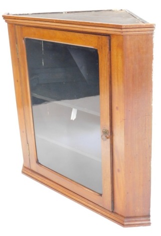 A mahogany hanging corner cabinet, with single glazed door and a moulded cornice, 86cm high, 86cm wide.