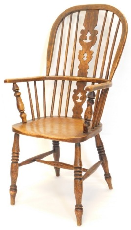 A late 19thC ash and elm Windsor chair, with a pierced splat and solid seat, on turned legs with H stretcher.