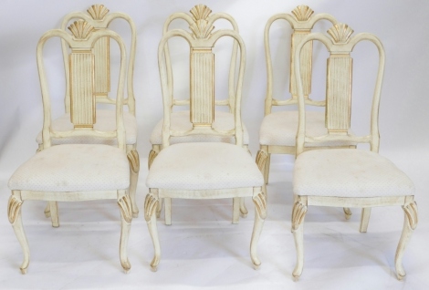 Withdrawn Pre-Sale A set of six cream and parcel gilt painted dining chairs, each with a shell shaped lobed back, a rectangular reeded splat and a padded seat on cabriole legs. The upholstery in this lot does not comply with the 1988 (Fire & Fire Furnish