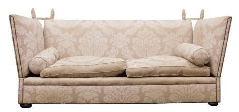 A large beige and cream damask Knoll sofa, by London maker George Smith, with studded borders, on bun feet, 239cm wide the frame 101cm deep, the seats 71cm deep approx. The upholstery in this lot does not comply with the 1988 (Fire & Fire Furnishing) Reg