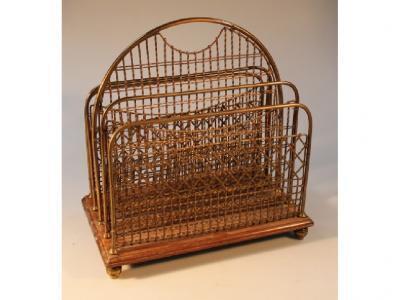 An early 20thC brass magazine rack