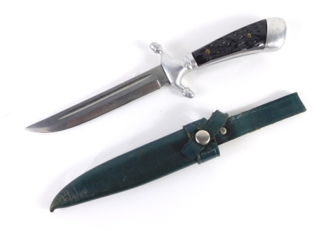 A R Plucker JR Solingen dagger, with chrome mounts, textured handle, and green leather scabbard, 25cm long.