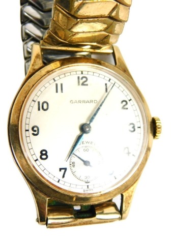 A 20thC Garrard 17 jewel wristwatch, with 3cm Arabic dial and subsidiary second hand, with elasticated bracelet, in outer box, with additional paperwork.