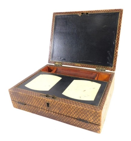 A 19thC pressed leather travelling writing box, of rectangular form, with hinged front revealing a space for ink bottles and pens, with writing slope, in pressed leather with flush handle, unmarked, 19cm high, 31cm wide, 24cm deep.