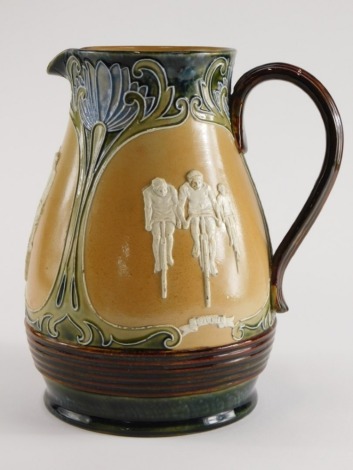 A Doulton Lambeth stoneware jug, decorated with panels of cyclists with titles Military Road Path within Art Nouveau tube lined compartments, initials to underside PB, 22cm high. (AF)