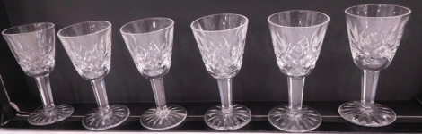 A set of six Waterford Crystal sherry glasses, each with a partially hobnail cut bell shaped bowl on a star cut base, 10cm high. (6)