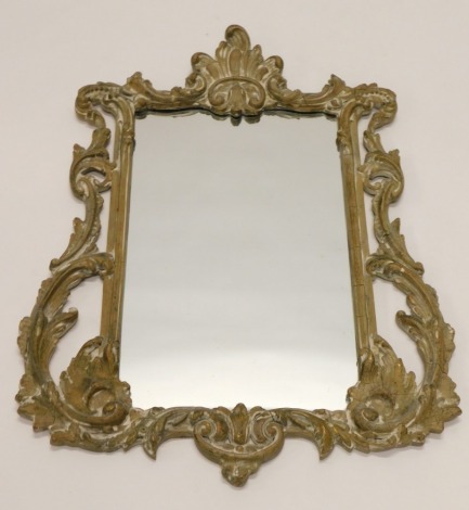 A 20thC gilt wood wall mirror, with rococo scroll decoration, 28cm high, 47cm wide.