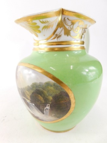 An early 19thC Bloor Derby porcelain jug, with beak spout, gilt highlighted handle and green body, hand painted with a scene of waterfall before castle, in the manner of Lucas, on a circular foot with orange D and crown mark beneath, 19cm high.