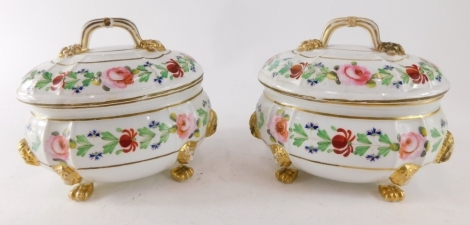 A pair of Derby porcelain lidded soup tureens, each polychrome decorated with summer flowers, in pink, green and blue with gilt highlights, on hair paw feet, 12cm high. (2)