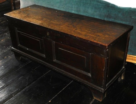 An 18thC oak sword chest, with lift top, fielded panels and bracket feet, 50cm high, 109cm wide, 39cm deep.