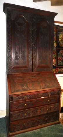 A 19thC carved oak bureau bookcase, 205cm high, 92cm wide, 50cm deep.