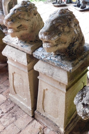 A pair of chimney pots, and a pair of lion mask finials. (4)