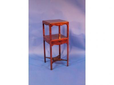 A George III mahogany washstand with replacement top